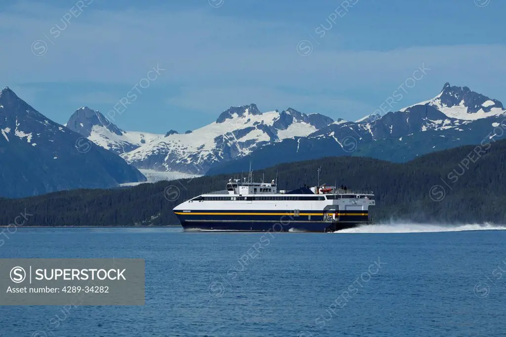 The Alaska Marine Highway System Fairweather ferry heads for Haines after departing Auke Bay with Coast Mountains in the distance, near Juneau, Inisde...