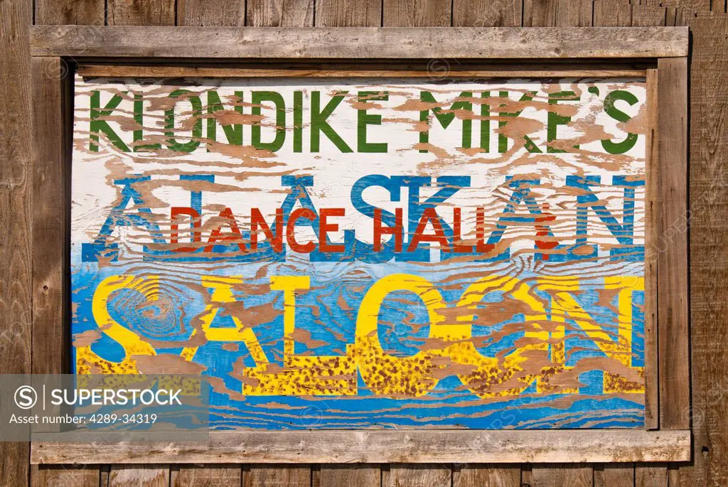 Close up of a sign for Klondike Mike´s Alaskan Saloon, Palmer, Southcentral Alaska, Summer. Digitally altered