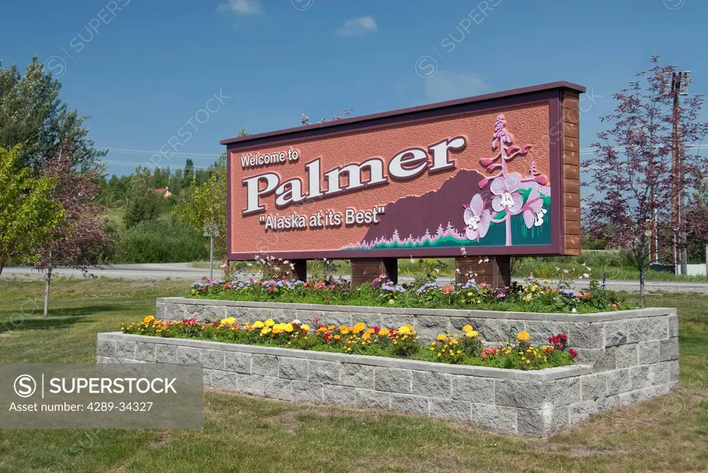 Sunny view of the welcome sign in Palmer, Mat_Su Valley, Southcentral Alaska, Summer. Digitally altered.