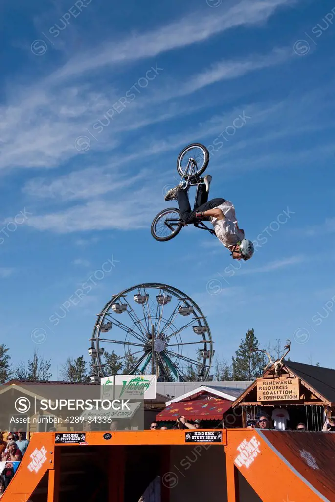 Bicyclist performing a stunt during the King BMX Stunt Show on a sunny day at the Alaska State Fair, Palmer, Southcentral Alaska, Autumn