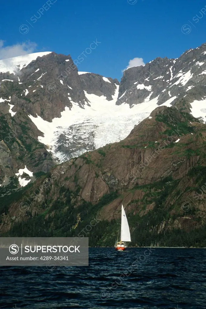 View of a sailboat on a sunny day in Resurrection Bay, Seward, Kenai Peninsula, Southcentral Alaska, Summer