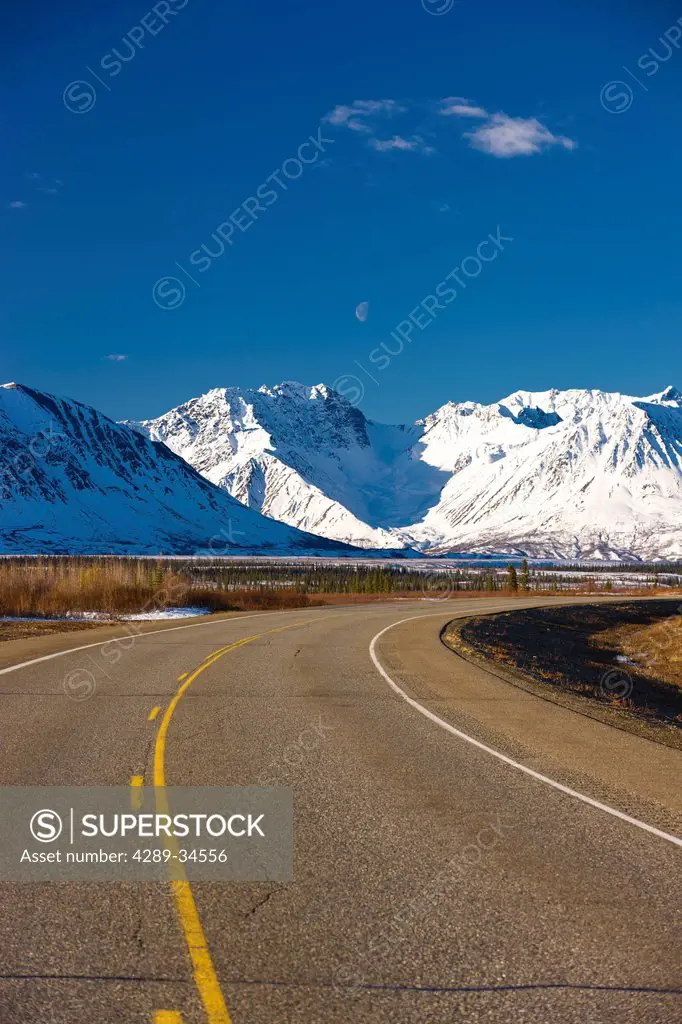 View of the George Parks Highway as it passes through the Alaska Range foothills in Broad Pass, Southcentral Alaska, Spring