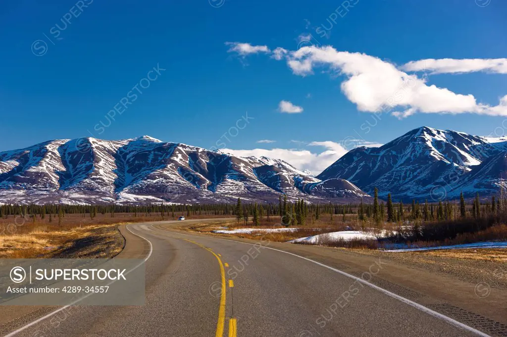 View of the George Parks Highway as it passes through the Alaska Range foothills in Broad Pass, Southcentral Alaska, Spring