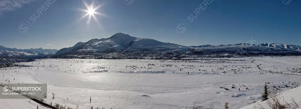 Panorama view of snowcovered Knob Hill and Knob Lake in the Sheep Mountain area, Southcentral Alaska, Winter