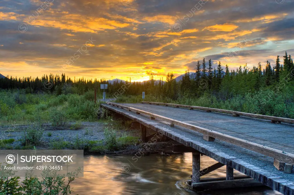 Sunset over Jack Creek off the Nabesna Road in Wangell St. Ellias National Park, Southcentral Alaska, Summer
