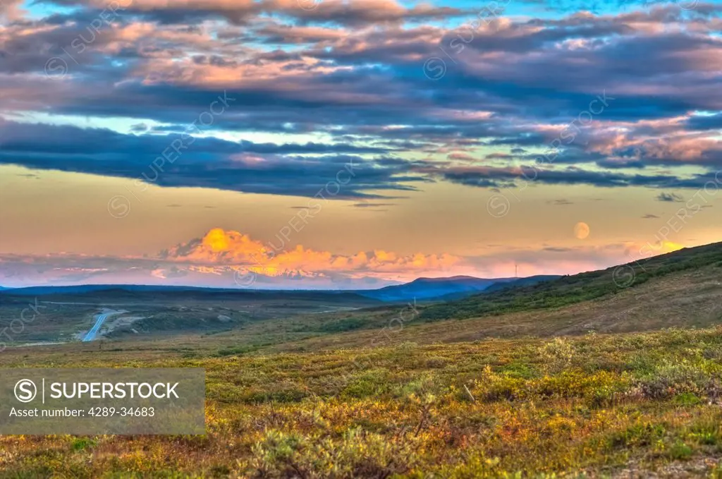 Moon rising and Mount Drum at sunset along the Denali Highway, Southcentral Alaska, Autumn. HDR