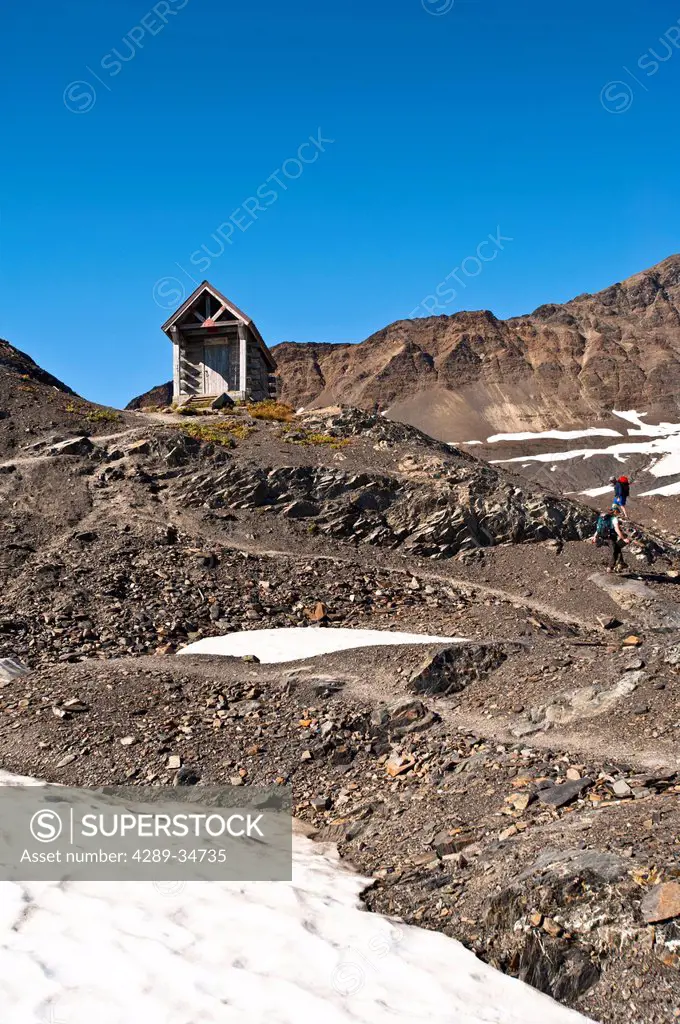 Hikers approach the Harding Icefield Shelter at the end of the Harding Icefield Trail at Exit Glacier in Kenai Fjords National Park, Southcentral Alas...