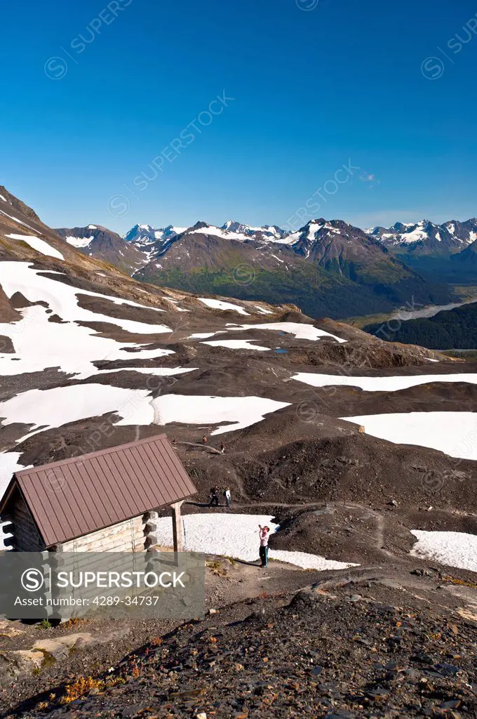 Scenic view of hikers at the Harding Icefield Shelter overlooking Exit Glacier, Chugach Mountains, and Resurrection Valley in Kenai Fjords National Pa...