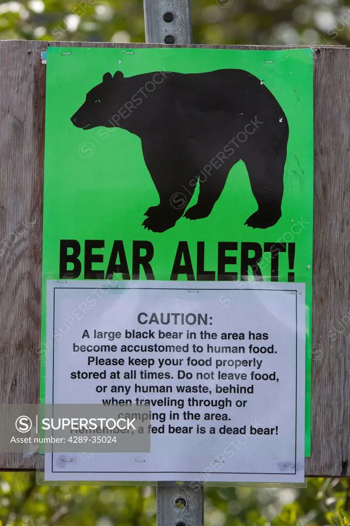 Sign posted near Portage warns of a bear sighting in the area, Southcentral Alaska, Spring
