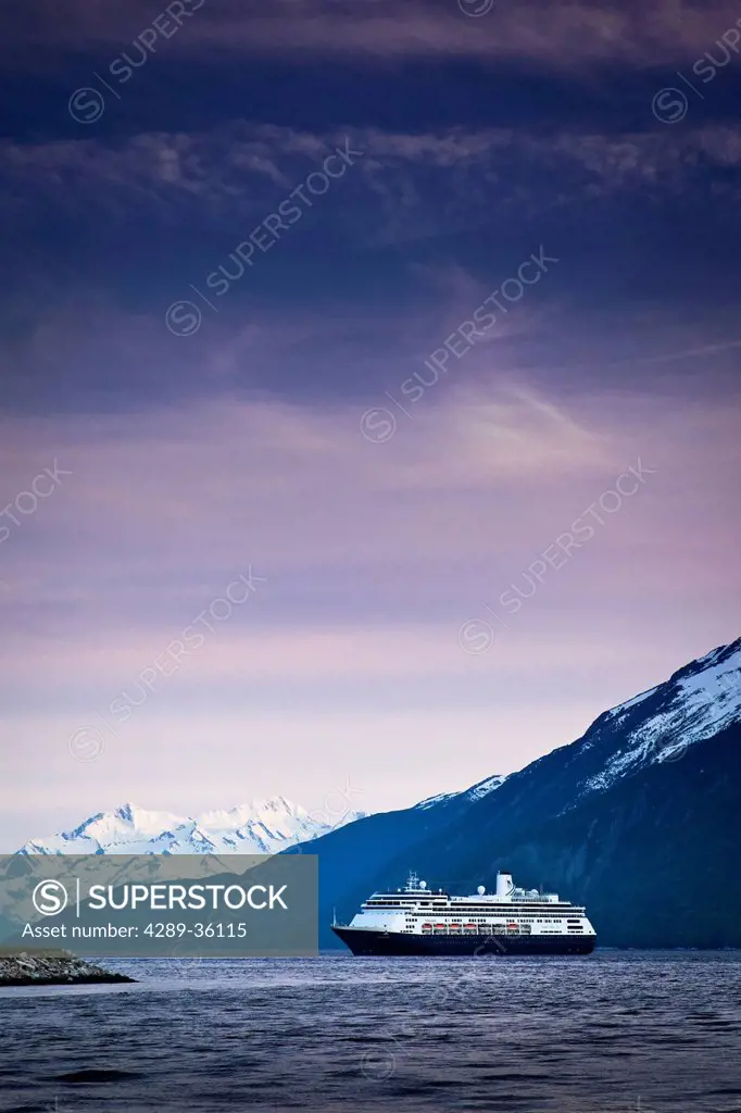 Holland America cruiseship Volendam leaving port of Skagway at twilight, Skagway, Southeast Alaska
