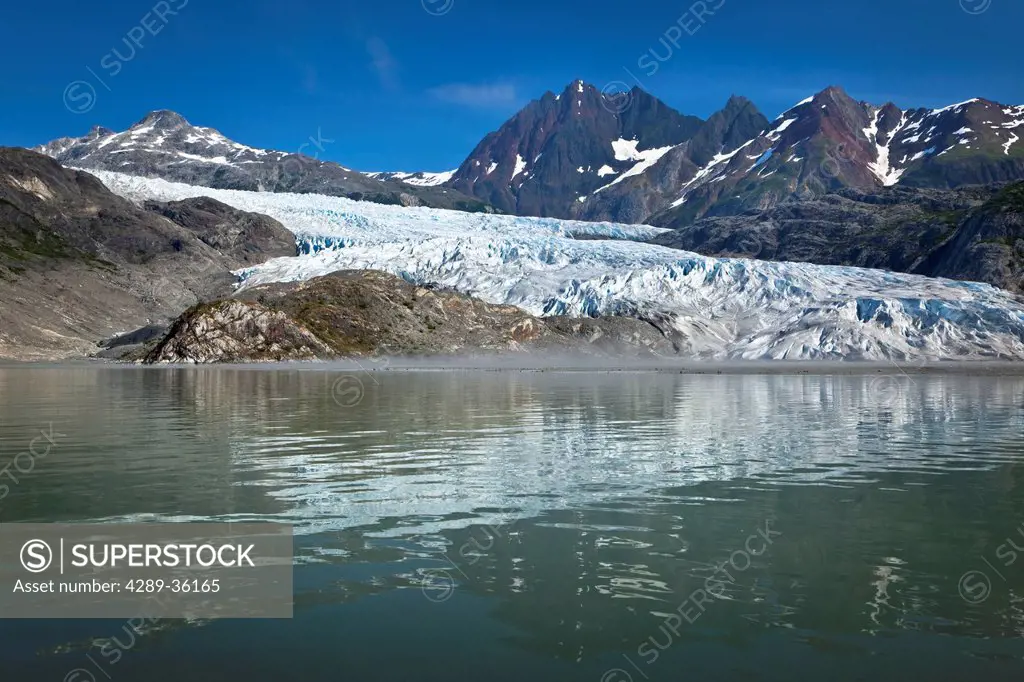 Scenic view of Riggs Glacier reflecting on the water of Muir Inlet, Glacier Bay National Park & Preserve, Southeast Alaska, Summer