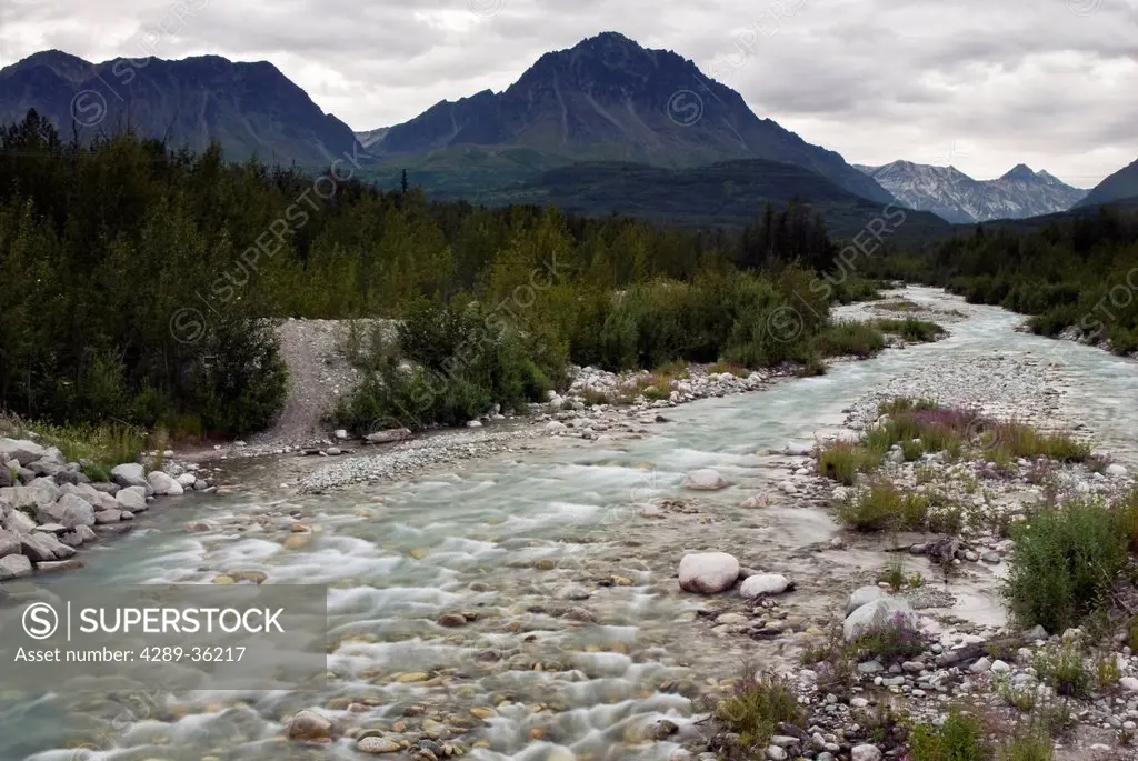 A tributary stream flows over rocks on its way to the Matanuska River, Southcentral Alaska, Summer
