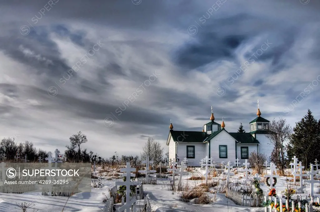 Dramatic winter skies over the Transfiguration of Our Lord Russian Orthodox Church in Ninilchik, Kenai Peninsula, Southcentral Alaska, Winter. HDR