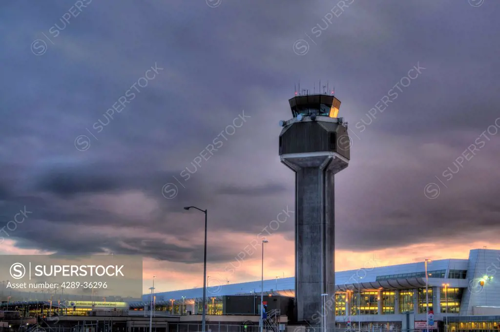 View of the control tower at the Ted Stevens Anchorage International Airport at sunset, Southcentral Alaska, Winter. HDR
