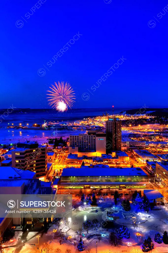 Rooftop view of the Fur Rondy fireworks over downtown Anchorage, Southcentral Alaska, Winter
