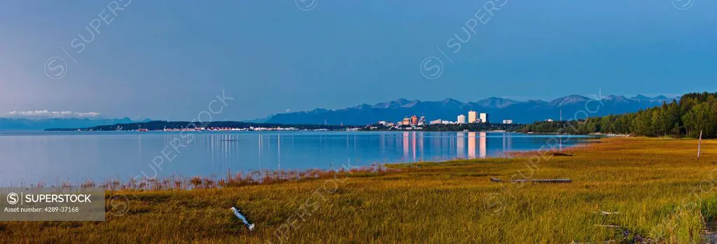 The Anchorage Skyline At Sunset Taken From The Tony Knowles Coastal Trail During High Tide, Southcentral Alaska