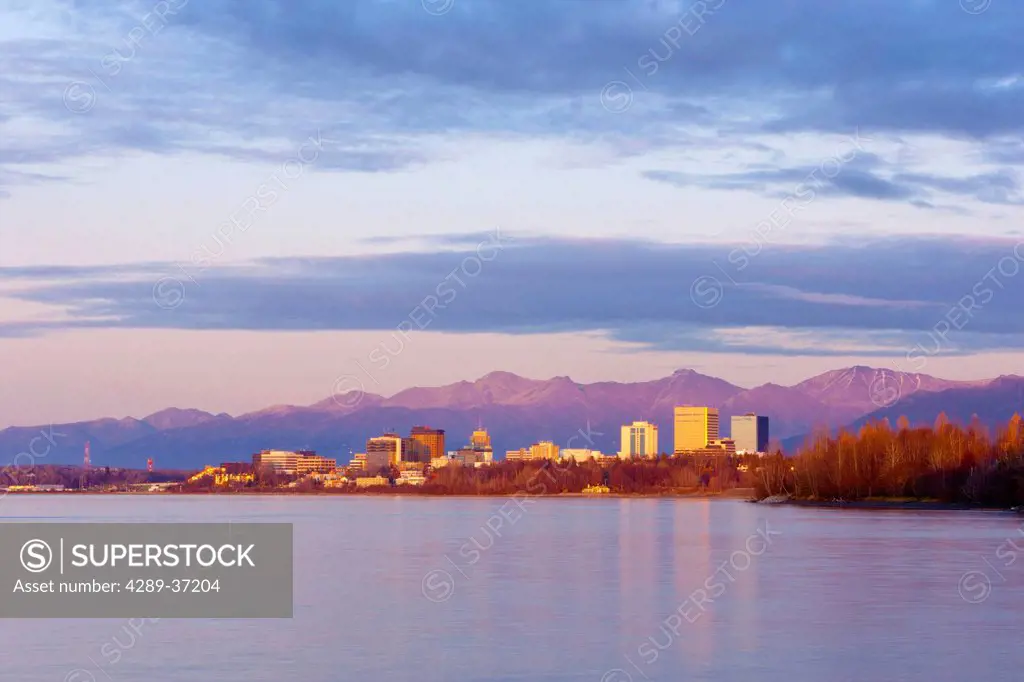 Sunset View Of The Anchorage Skyline Reflecting In The Waters Of Cook Inlet And Knik Arm, Southcentral Alaska, Fall