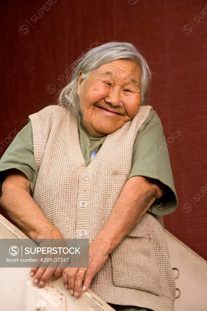 Portrait Of Elder Native Yupik Woman On Front Stairs Of Her Home Akiak Western Alaska Summer