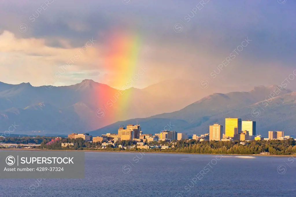 Rainbow Above The Anchorage City Skyline And Knik Arm At High Tide, Chugach Mountains In The Background, Southcentral Alaska, Summer