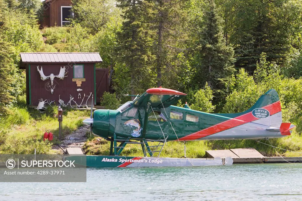 A Floatplane Docked In Front Of One Small Outbuilding Of The Alaska Sportsman's Lodge; Bristol Bay Alaska United States Of America
