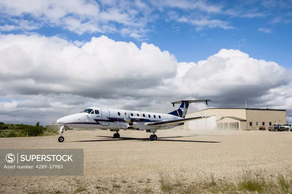 A Commercial Passenger Airplane Taxis In Front Of A Hangar At A Small Airport Carrying Sport Fishing Lodge Guests; Igiugig Bristol Bay Alaska United S...