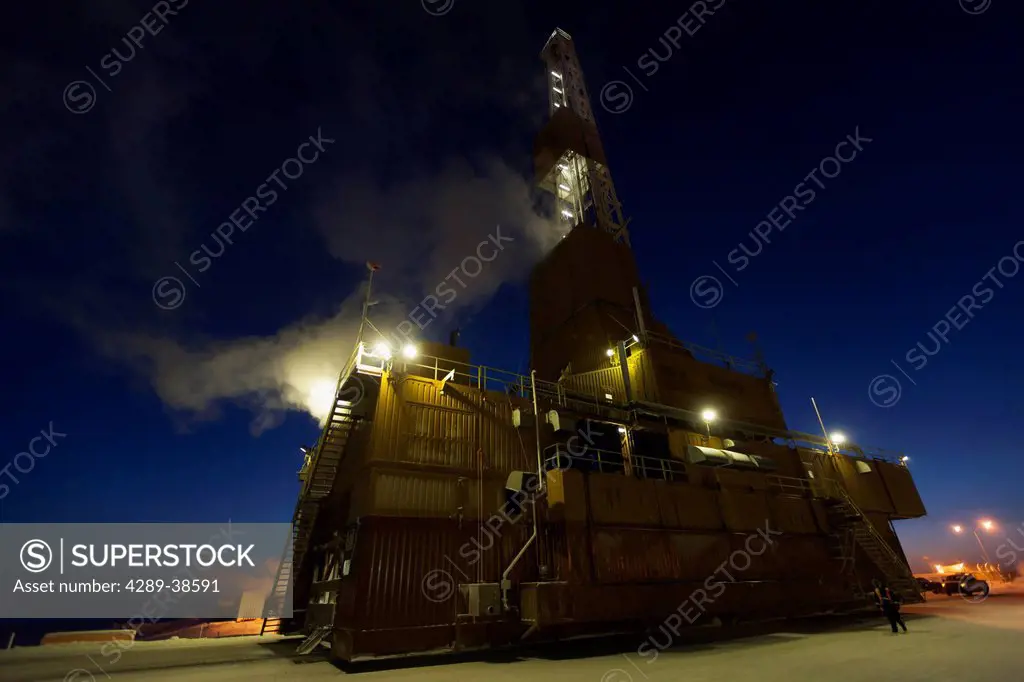 Doyon Oil Rig 14 on the road moving to another drill site in the Prudhoe Bay Oil Field, North Slope, Arctic Alaska, Winter