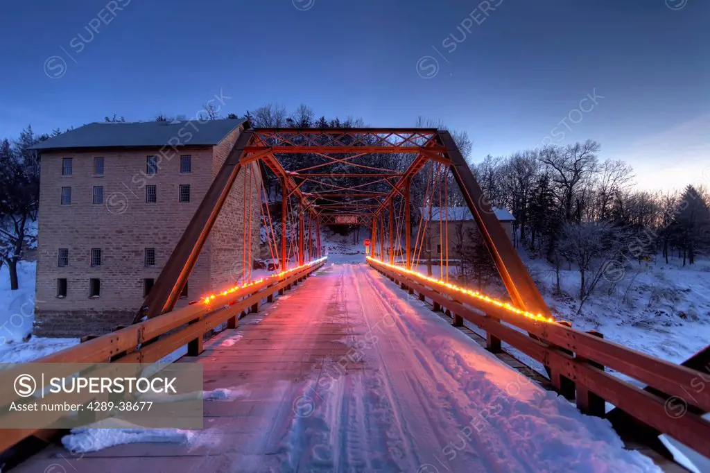 Christmas lights on the bridge crossing the Turkey River at Motor Mill in Clayton County in Northeast Iowa, Winter, HDR