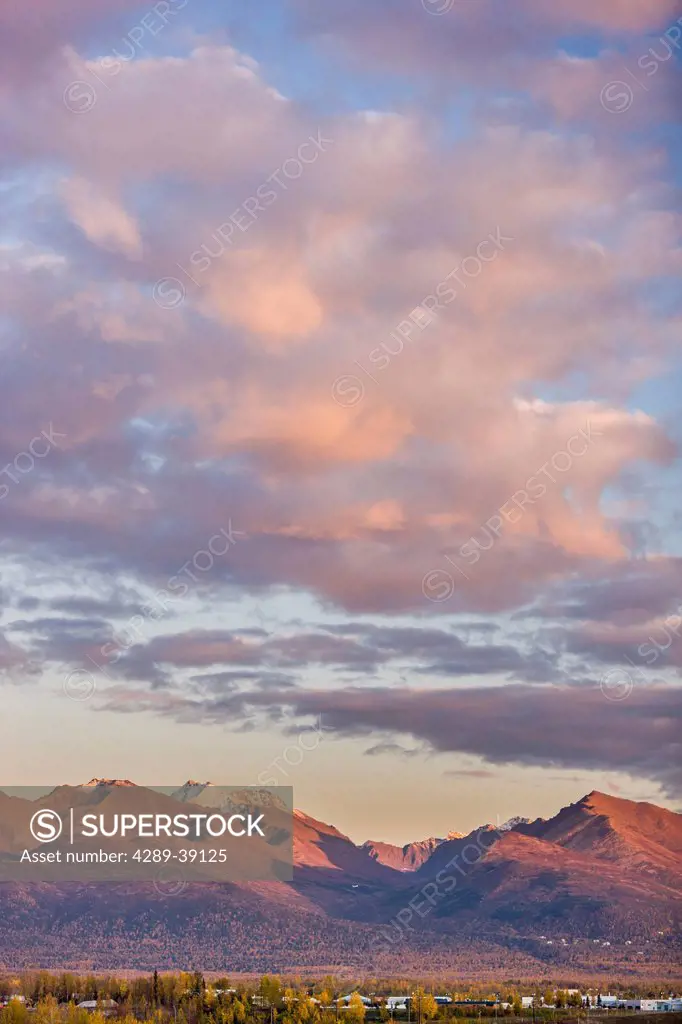 Sunset light on the Anchorage Hillside and Chugach Mountains, fall colors and termination dust on the mountains, Fall Anchorage, Southcentral Alaska, ...