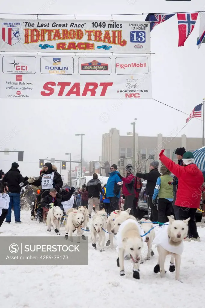 Jim Lanier and team leave the ceremonial start line at 4th Avenue and D street in downtown Anchorage during the 2013 Iditarod race.