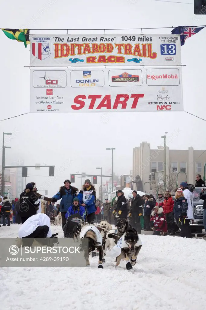 James Volek and team leave the ceremonial start line at 4th Avenue and D street in downtown Anchorage during the 2013 Iditarod race.