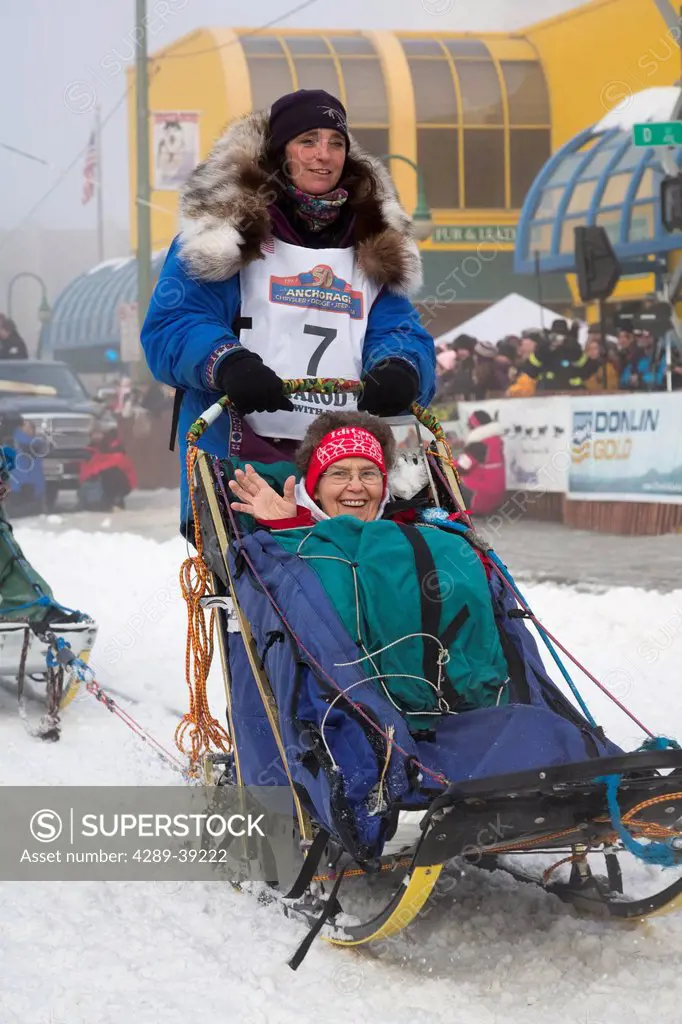 Michelle Phillips and team leave the ceremonial start line at 4th Avenue and D street in downtown Anchorage during the 2013 Iditarod race.