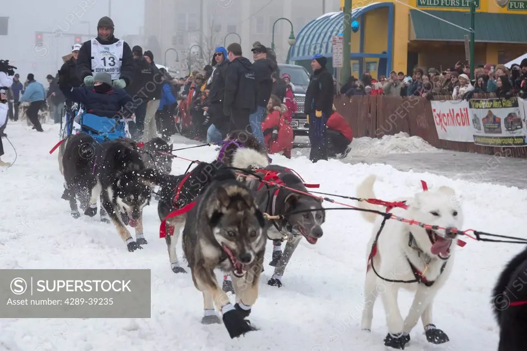 John Baker and team leave the ceremonial start line at 4th Avenue and D street in downtown Anchorage during the 2013 Iditarod race.
