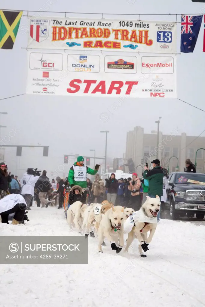 Kelly Maixner and team leave the ceremonial start line at 4th Avenue and D street in downtown Anchorage during the 2013 Iditarod race.