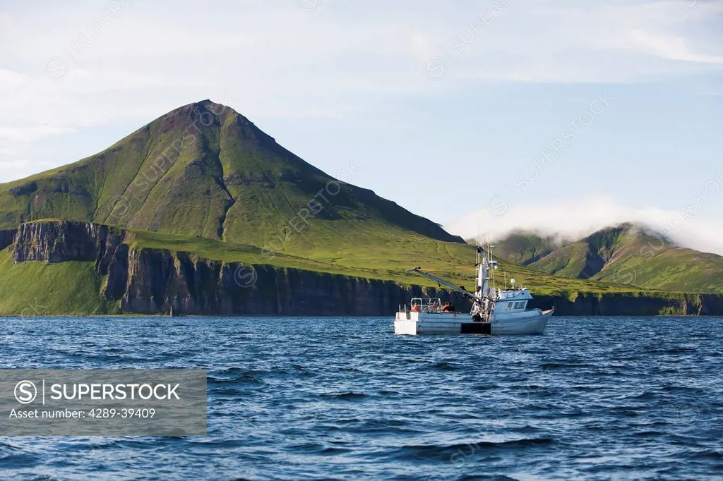 The F/V Lucky Dove commercial halibut fishing in Ikatan Bay near False Pass on Unimak Island, Southwest Alaska, summer.