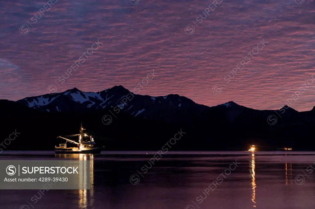 The F/V Lucky Dove on anchor in False Pass near the Laukitis family fishcamp on the Alaska Peninsula and the town of False Pass on Unimak Island, the ...