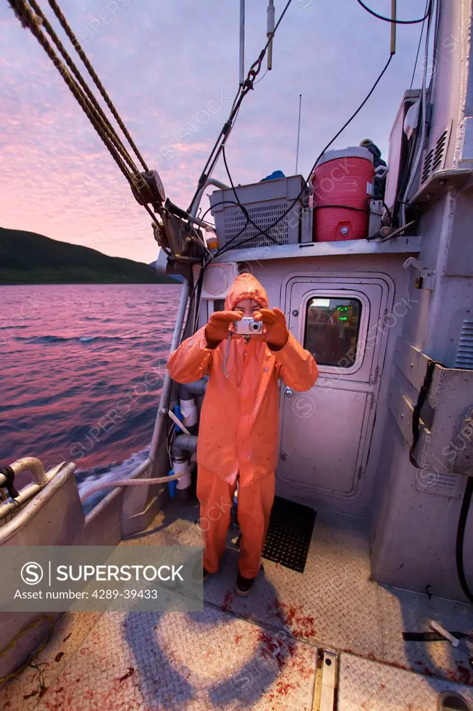 Fisherman documents a beautiful summer sunset while commercial halibut fishing in Southwest Alaska, Summer.