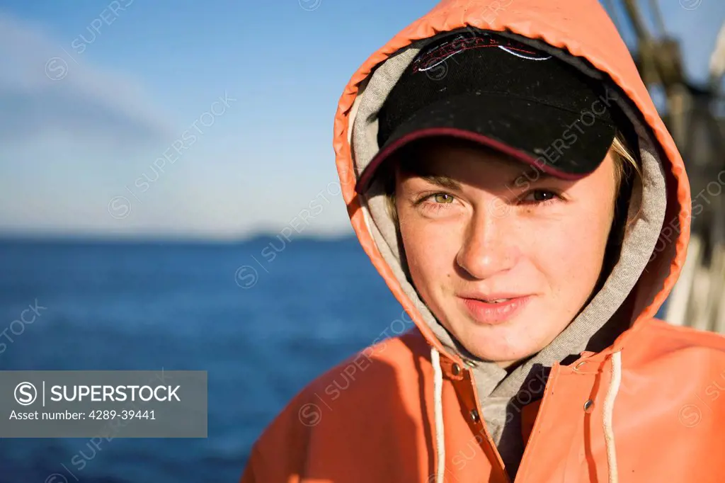 Portriat of Emma Laukitis in her raingear while commercial halibut fishing in Southwest Alaska, summer.