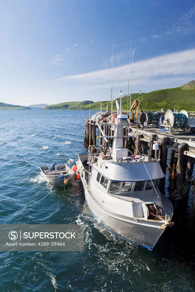 The F/V Lucky Dove tied to the dock in False Pass on Unimak Island, the Aleutians, Southwest Alaska, summer.