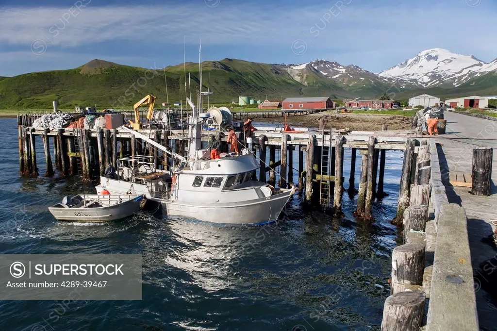 The F/V Lucky Dove tied to the dock in False Pass on Unimak Island, the Aleutians, Southwest Alaska, summer.