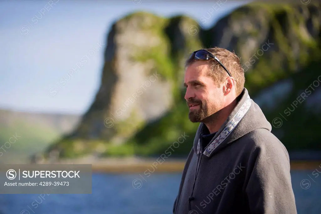 Portrait of Buck Laukitis on the water near his family's fish camp and home on the Alaska Peninsula side of False Pass, Southwest Alaska, summer.