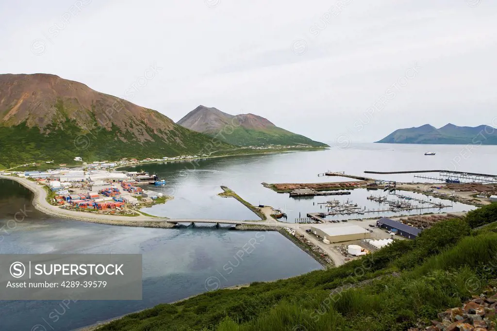 View of the City of King Cove and King Cove Lagoon from atop a nearby mountain. The Fish cannery complex and dock operated by Icicle Seafoods covers m...