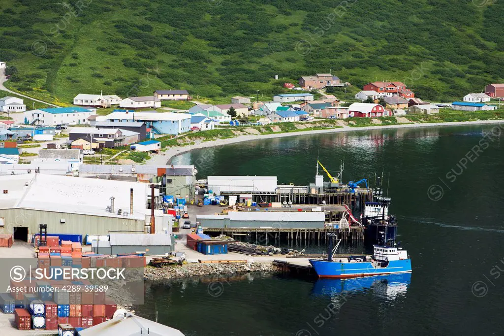 View of the fish cannery and dock, operated by Icicle Seafoods, and city of King Cove from a nearby mountain, Alaska Peninsula, Southwest Alaska, summ...