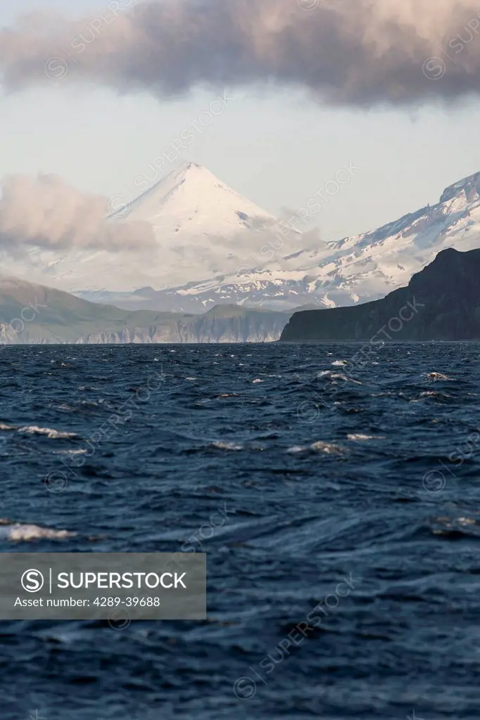 Shishaldin Volcano, the flank of Isanotski Peaks and the rugged cliff shoreline of Cape Pankof on Unimak Island, Eastern Aleutian Islands, Southwester...