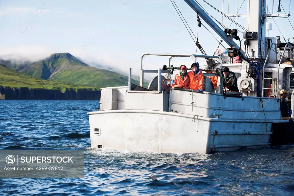 The Laukitis sisters pose at the back rail of the F/V Lucky Dove while commercial halibut fishing in Ikatan Bay near False Pass, Southwest Alaksa, sum...