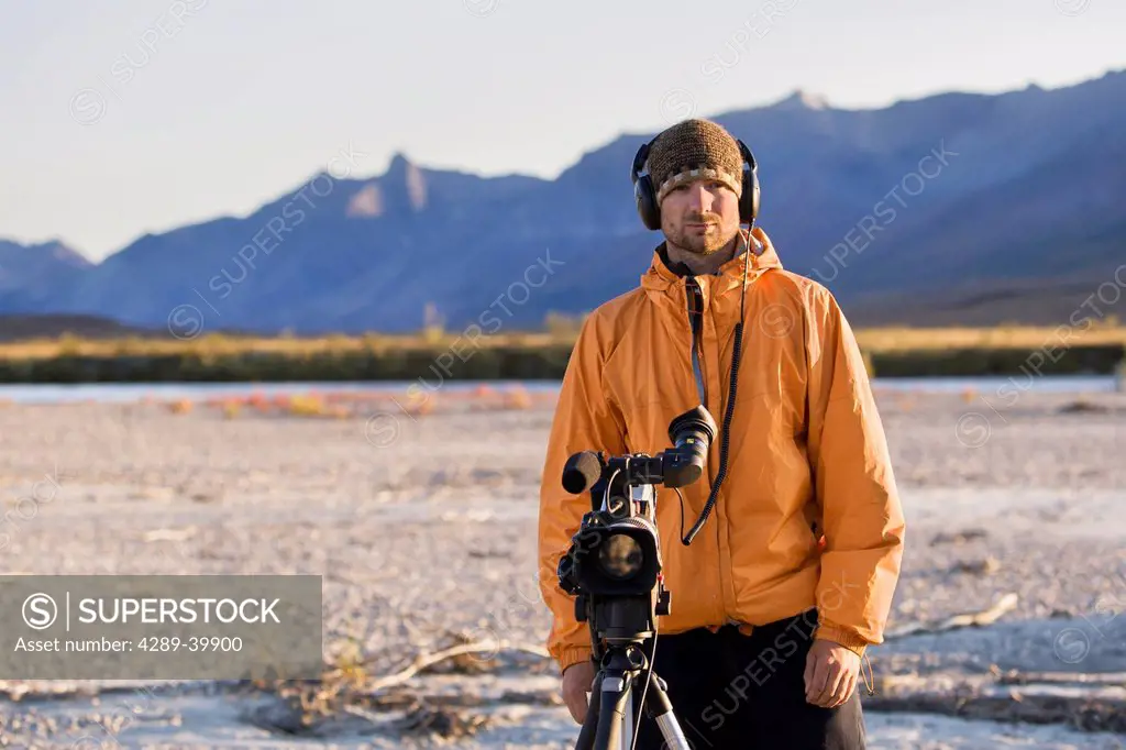 Videographer on Noatak River rafting trip in the Brooks Range, Gates of the Arctic National Park, Northwestern Alaska, above the Arctic Circle, Arctic...