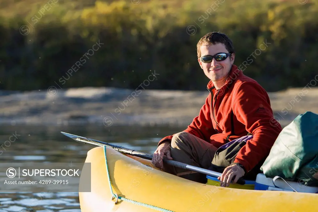Rafter on Noatak River during rafting trip in the Brooks Range, Gates of the Arctic National Park, Northwestern Alaska, above the Arctic Circle, Arcti...