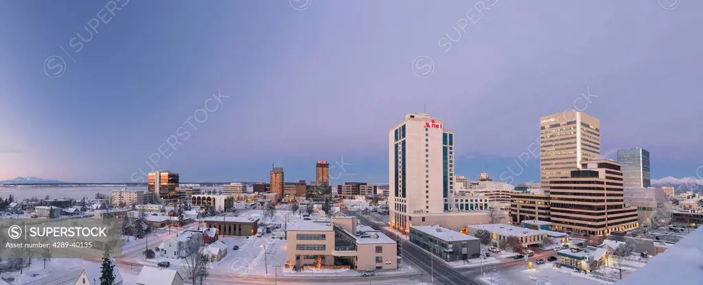Elevated panorama view of downtown Anchorage Skyline, Knik arm and Mount Susitna in the background at twilight winter, Anchorage, Southcentral Alaska,...