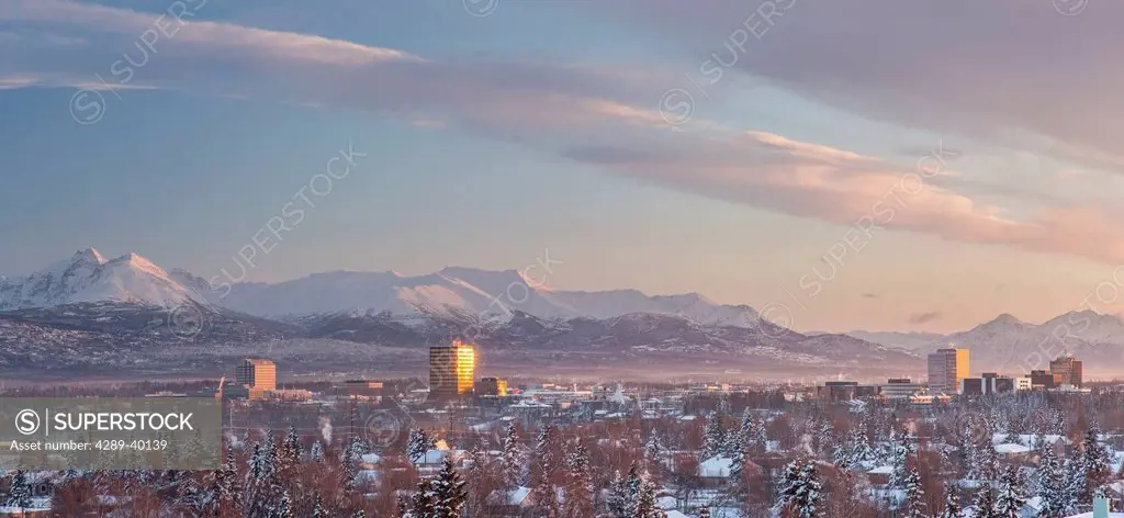 Elevated view of Midtown Anchorage, Looking South from the Parkstrip, Kenai Mountains in the background, sunset, winter, Anchorage, Southcentral Alask...