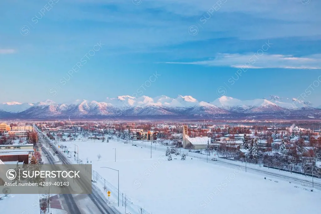 Elevated view of the downtown Parkstrip, Looking Southeast from Downtown, Chugach Mountains in the background, sunset, winter, Anchorage, Southcentral...