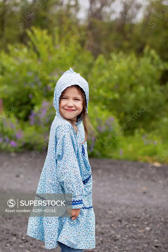 Eskimo girl wearing an Alaskan Native kuspuk in Palmer, Southcentral Alaska in Summer